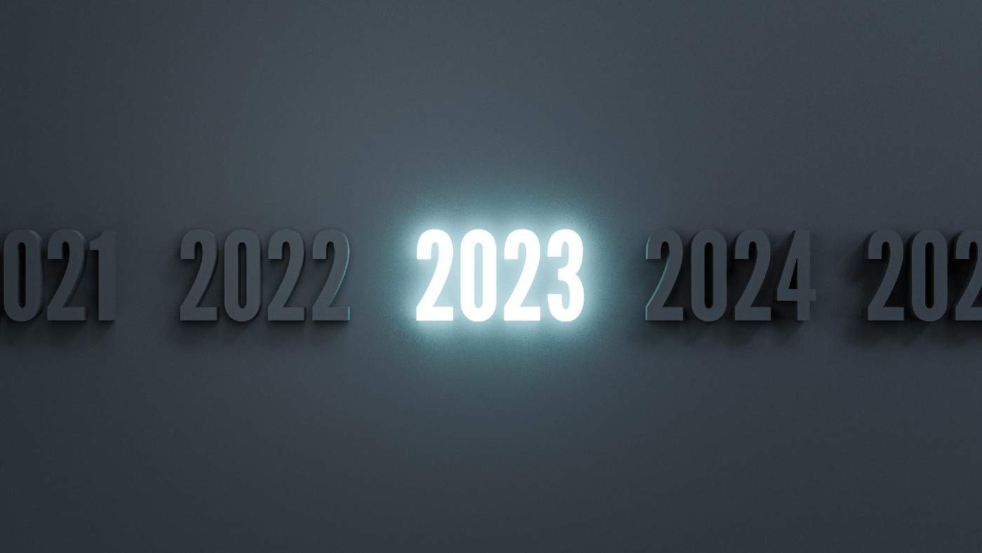 Glowing 2023 year among normal numbers on dark black background