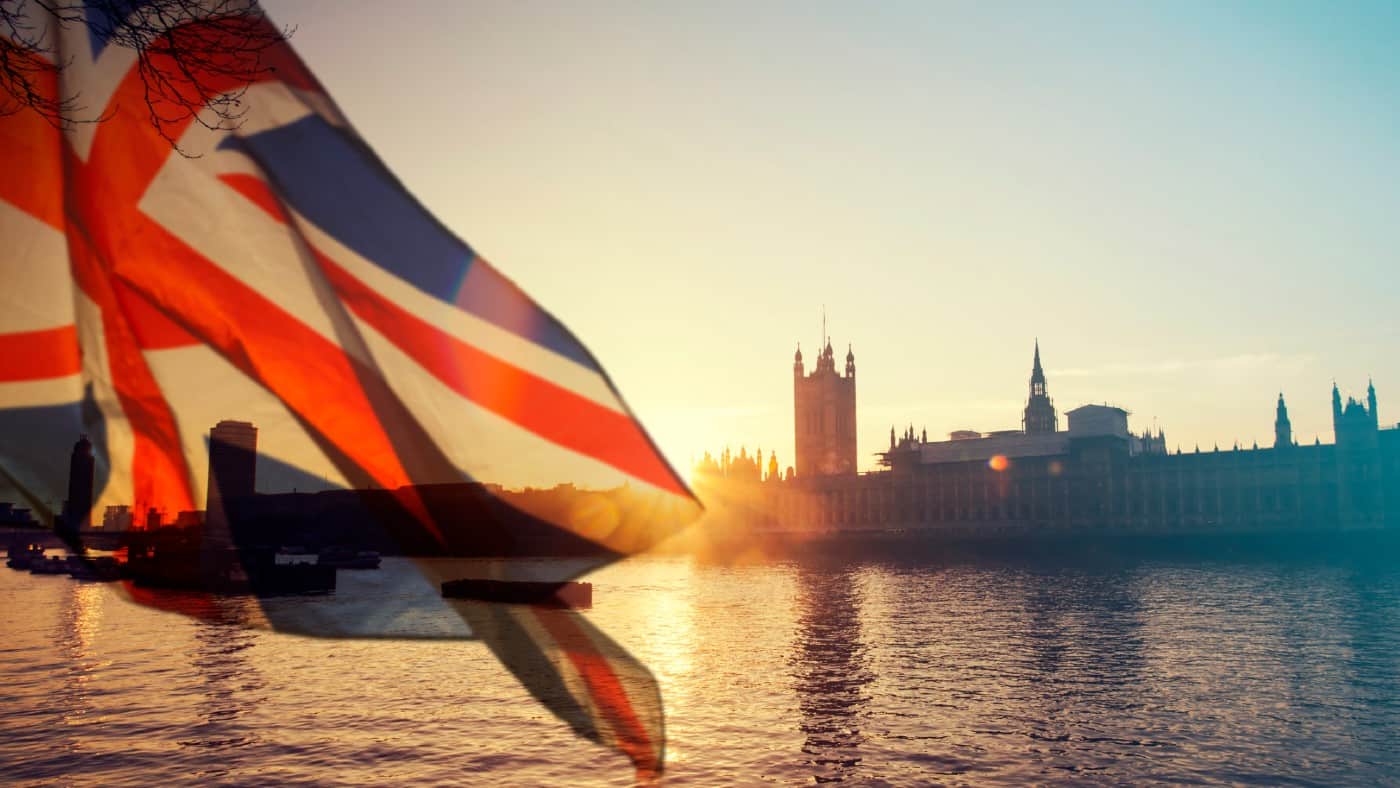 British union jack flag and Parliament house at city of Westminster in the background