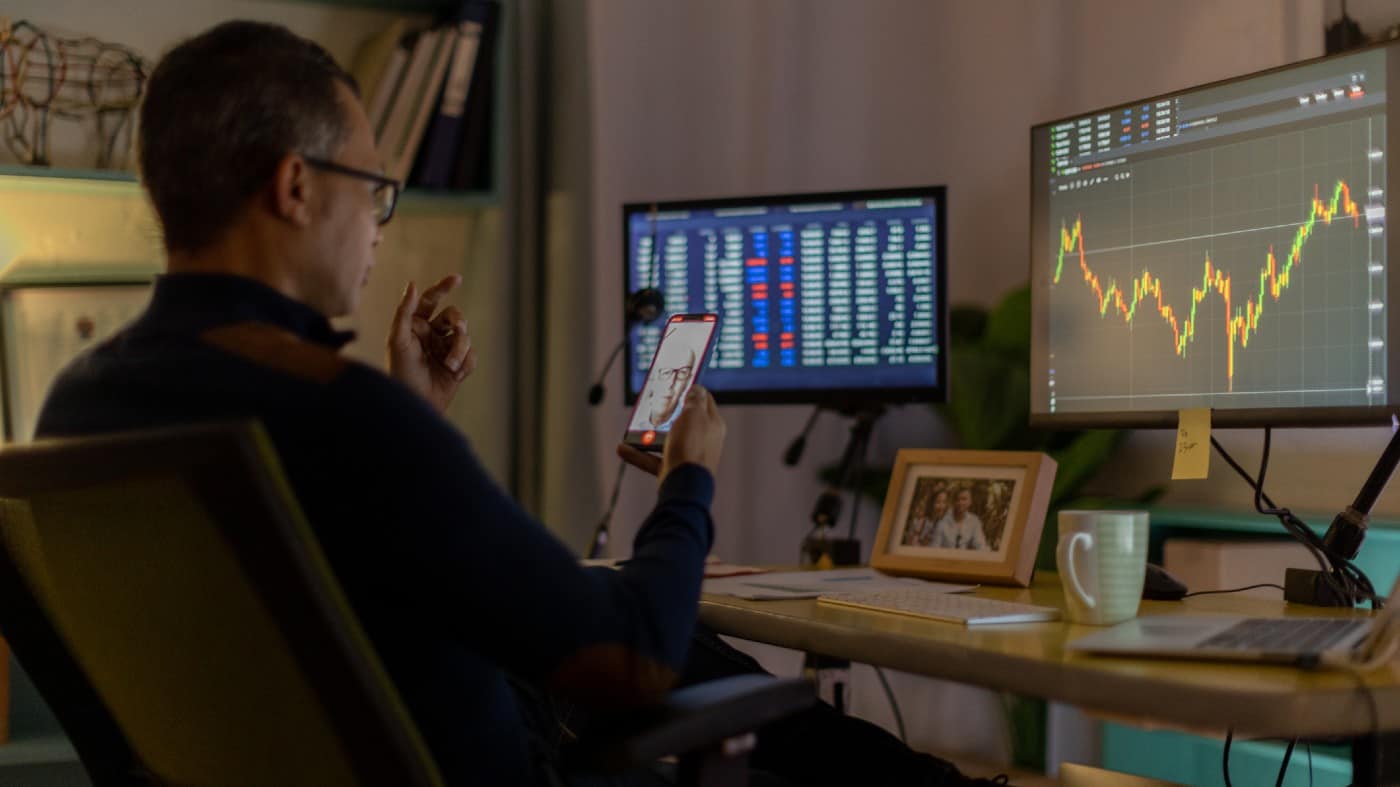 Trader on video call from his home office