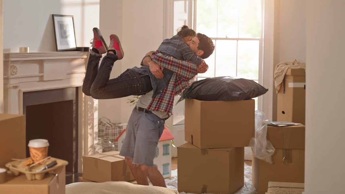 A couple celebrating moving in to a new home