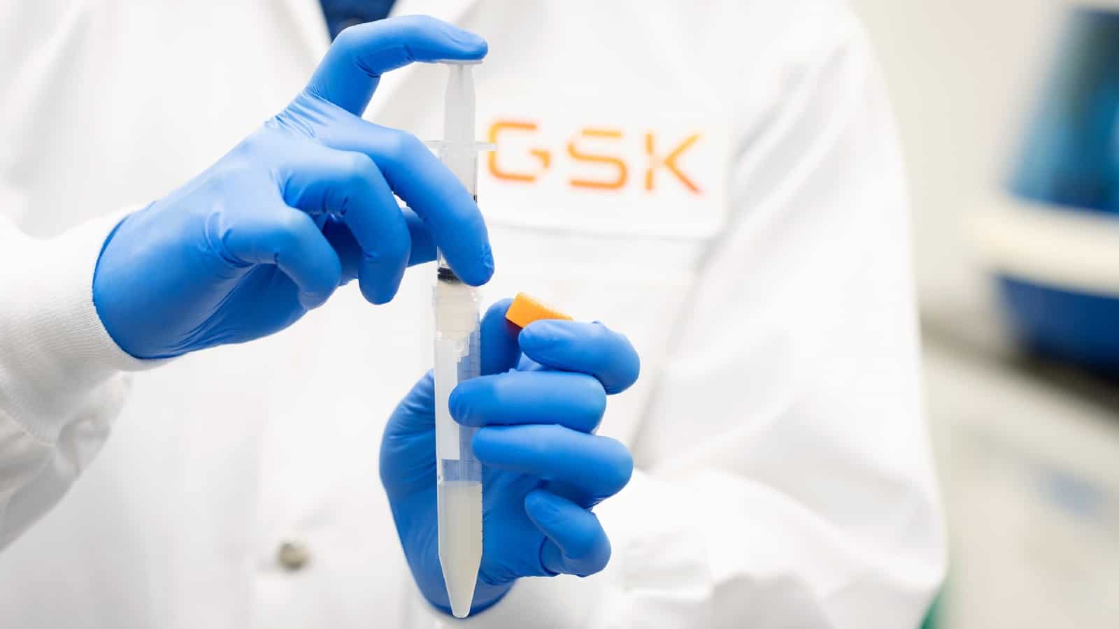 GSK scientist holding lab syringe