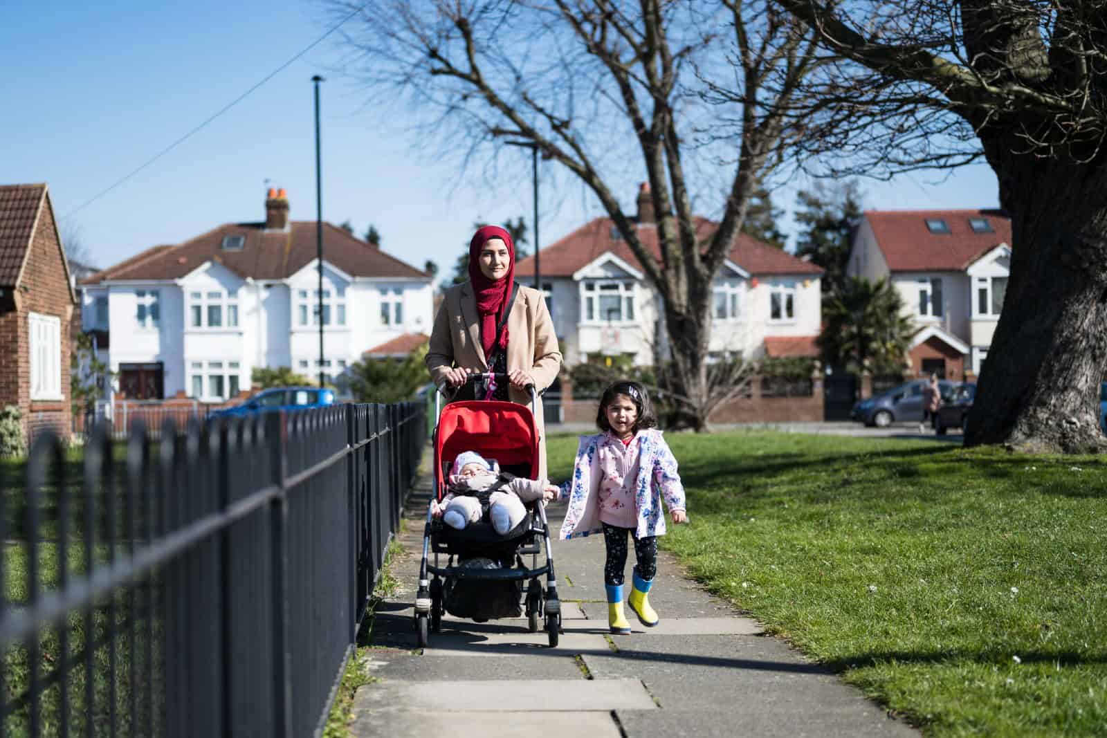 British Asian mother and young children enjoying exercise