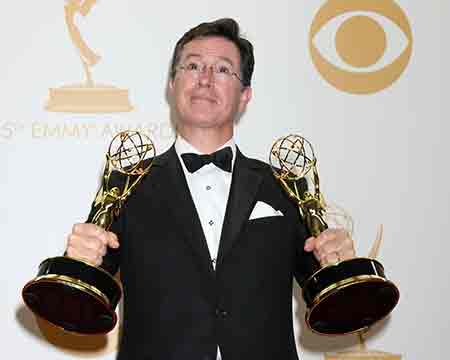 Stephen Colbert with two of his three current Emmy's with another nomination announced just 24 hours before the announcement of the shows cancellation