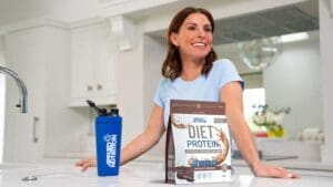 Applied Nutrition, the sports nutrition business backed by JD Sports and Coleen Rooney, has posted forecast-beating sales and profits in its first year as a public company, defying concerns over consumer spending.