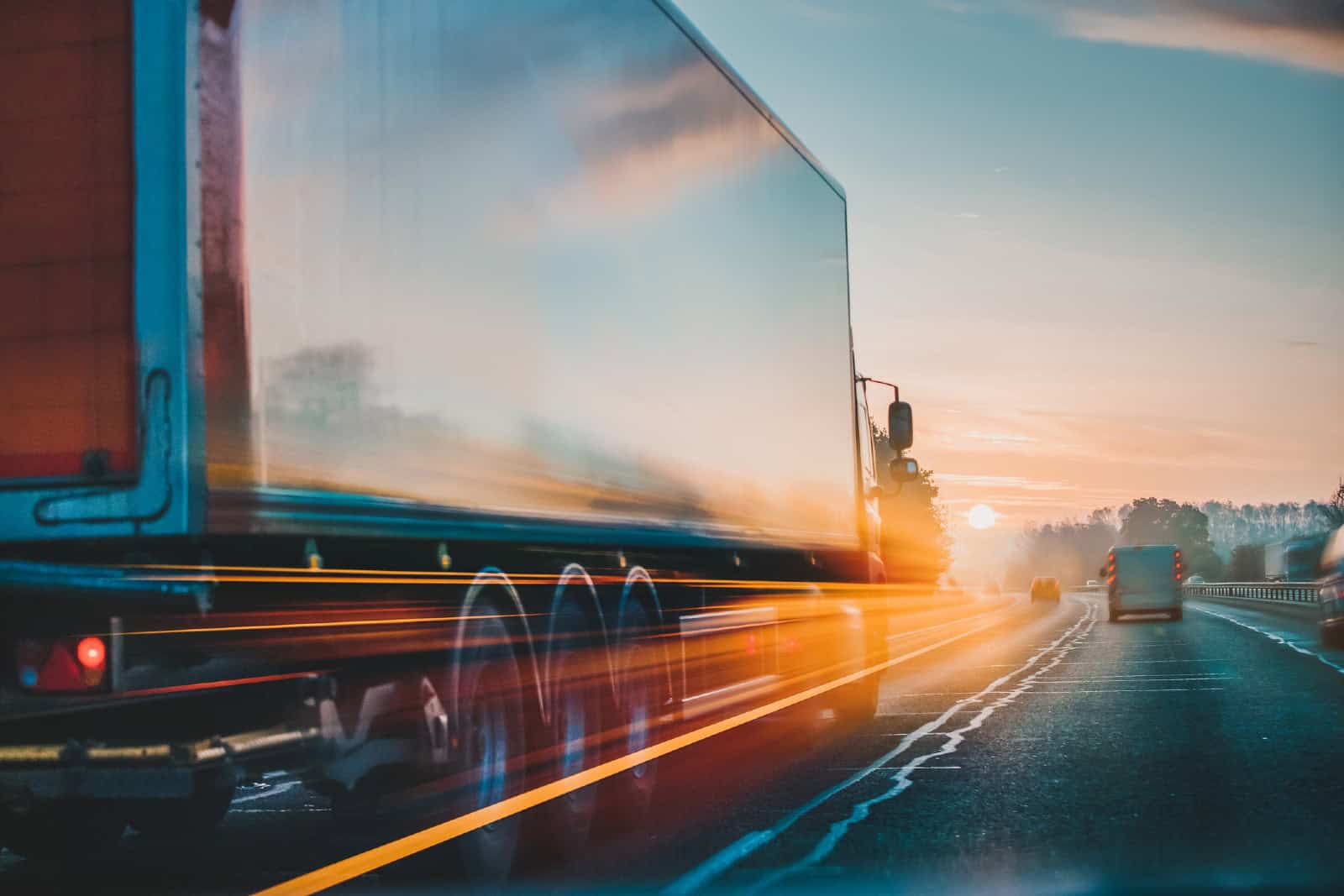 Red lorry on M1 motorway in motion near London