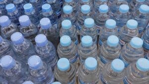 John Lewis has been forced to supply months’ worth of bottled water to residents in a Hampshire village after fertiliser pollution made the local supply unsafe to drink.