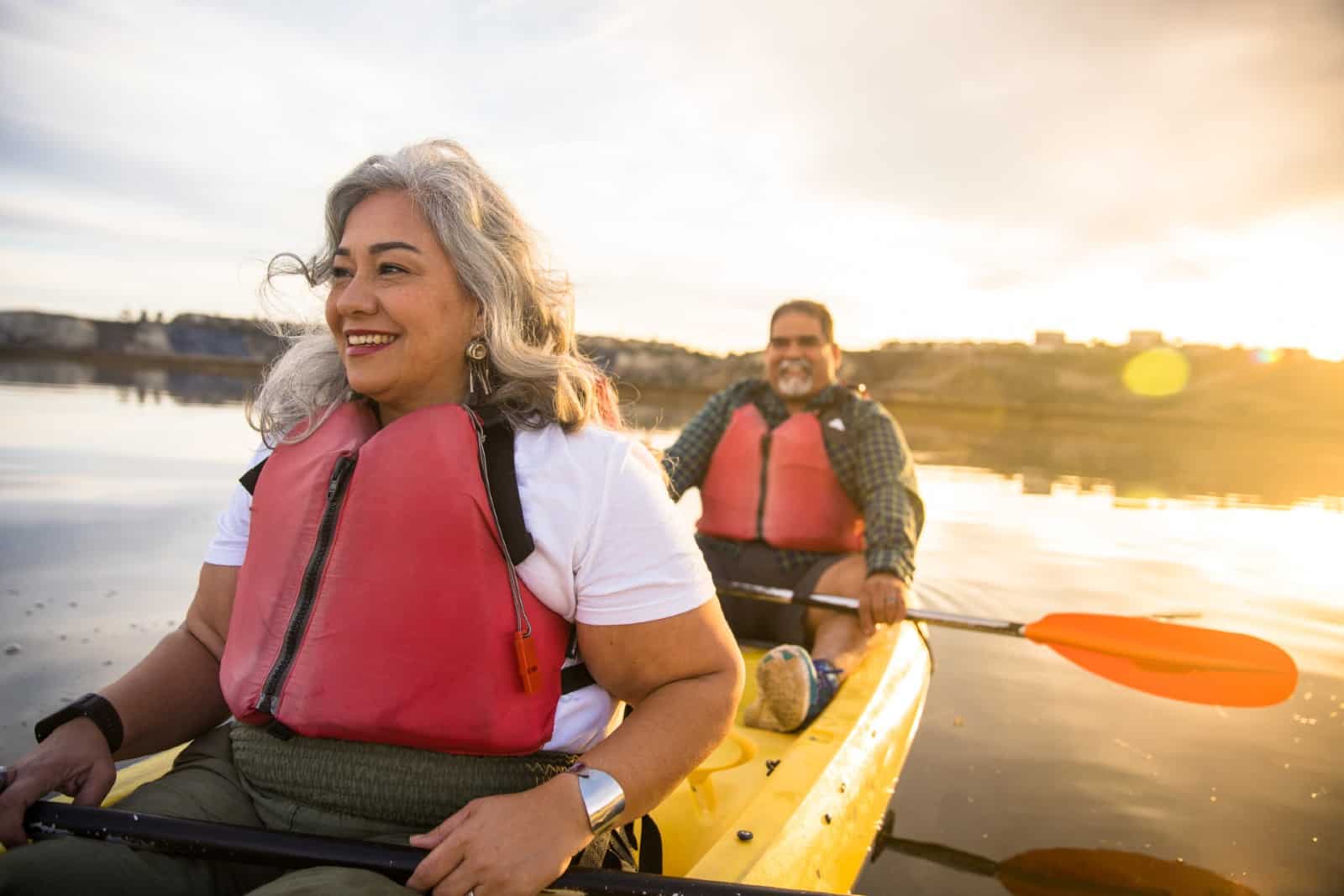 A senior Hispanic couple kayaking